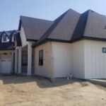 Residential roof replacement with new asphalt shingles in progress